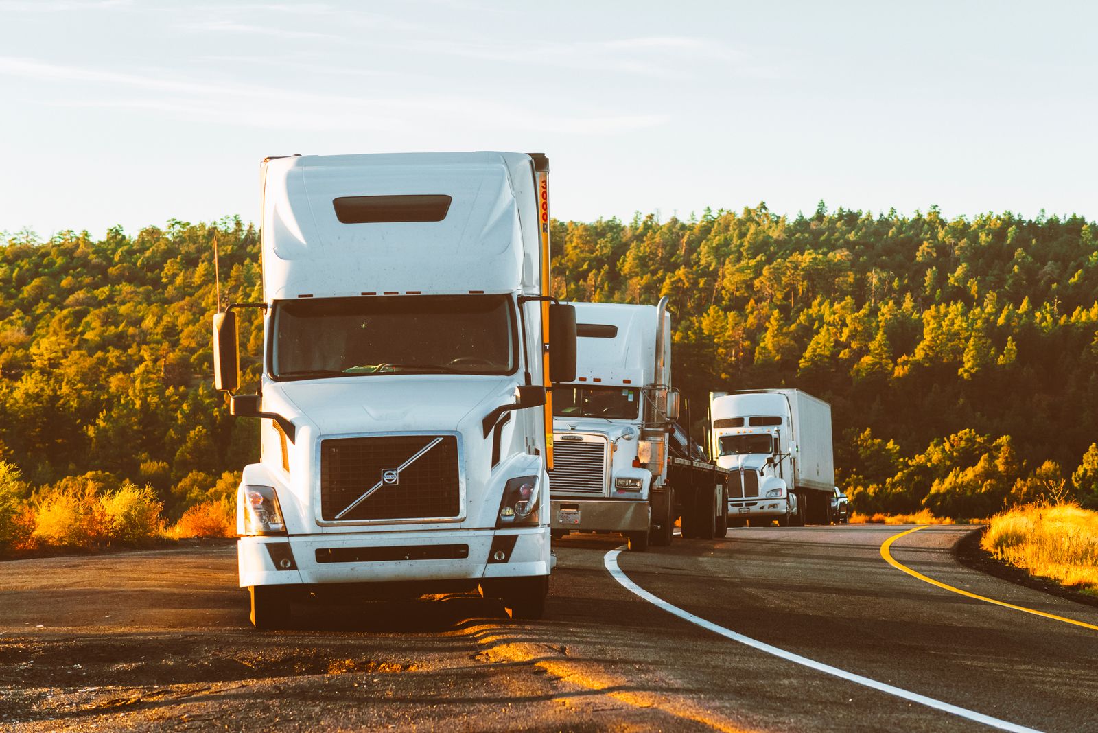 Freight trucks on a highway; illustrative stock photograph
